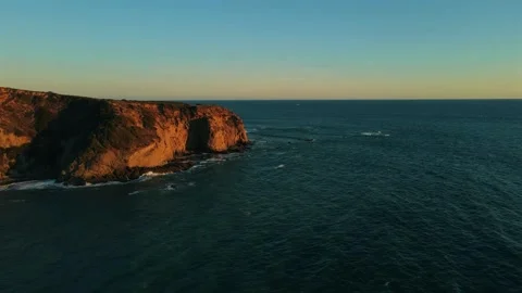 Dramatic ocean cliffs, golden hour coast, scenic sea view Stock Footage 311637342