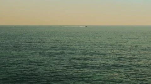 Dramatic ocean cliffs sea caves and tourist boats in Algarve Portugal Video stock 336731032