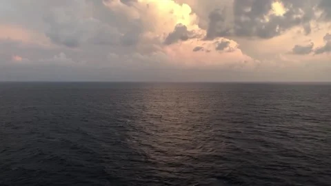 Dramatic Ocean Horizon Under Storm Clouds at Sunset Stock-Footage 336461991