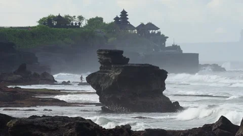 Dramatic Ocean Landscape Featuring Layered Cliffs And Distant Shrine 動画素材 347248775