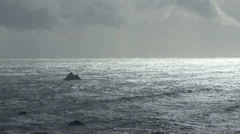 DRAMATIC OCEAN SCENE WITH SOLO ROCK AND NEGATIVE SPACE Stock Footage 59069896