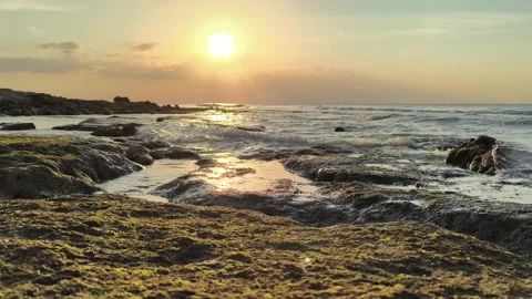 Dramatic Ocean Sunset over Rocky Coastline with Waves and Tide Pools Video stock 341504798