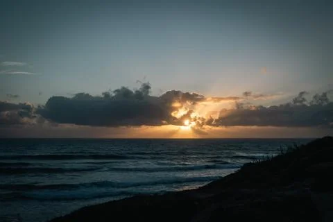 Dramatic Ocean Sunset From Silhouetted Cliff - Portuguese Coast Stock Photos