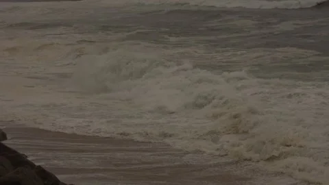 Dramatic Ocean Waves Crash Onto Wild Seaside After a Storm at Sunset Stock Footage 341684016