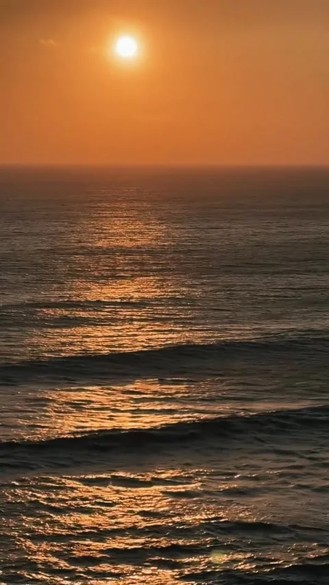 Dramatic Ocean Waves in Fiery Orange Sunset Light. Stock Footage 327039412