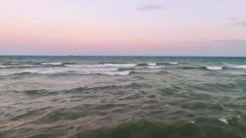 Dramatic Ocean Waves Under Pink Sunset Sky Background Stock Footage 341295887