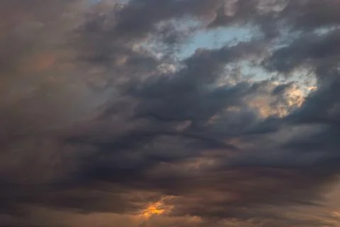 Dramatic or cinematic cloudscape at sunset or sunrise. Stock Photos