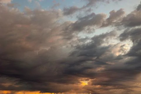 Dramatic or cinematic cloudscape at sunset or sunrise. Cloudy sky Stock Photos