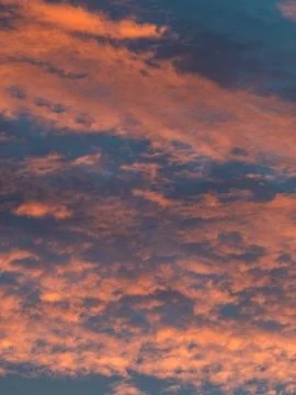 Dramatic Orange and Blue Sunset Clouds Filling the Sky, Vivid Vertical Clou.. Stock Photos