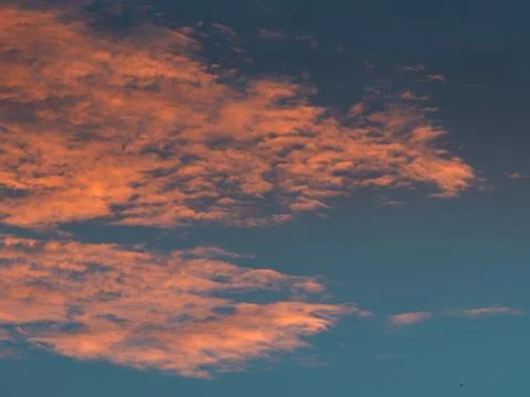 Dramatic Orange and Blue Sunset Clouds Filling the Sky, Vivid Vertical Clou.. Stock Photos