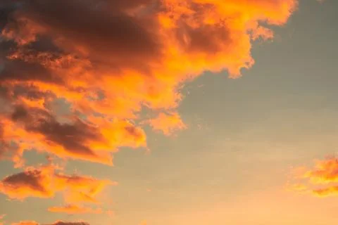 Dramatic Orange Clouds at Sunset Stock Photos