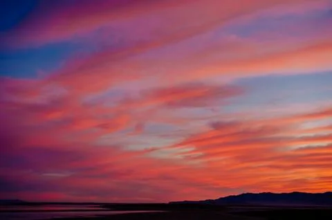 Dramatic orange colour cloudscape in evening sky, Bonneville, Utah, USA Stock Photos