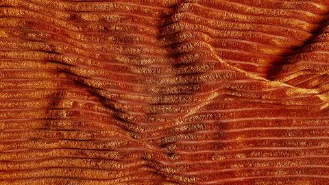 Dramatic orange fabric undulates in flowing wavy pleats revealing rich gran.. Stock Photos