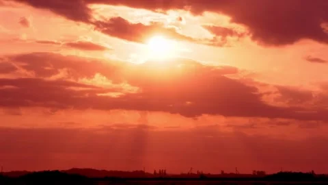 Dramatic Orange Red Sky at Sunset Sun and Colorful Clouds in the Field Time laps Stock Footage 266998538