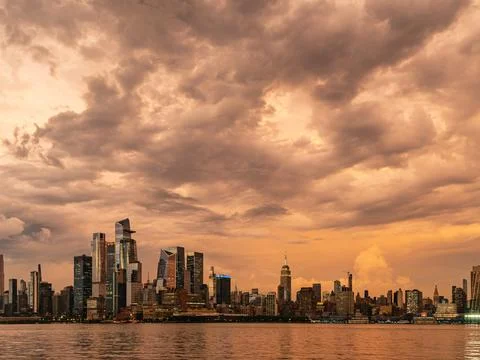 Dramatic Orange Sky after Storm, Midtown New York City at Sunset Stock Photos