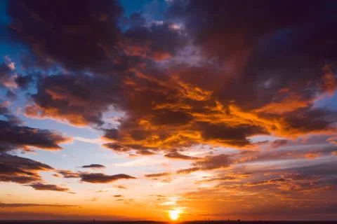 Dramatic orange sky at sunset Stock Photos