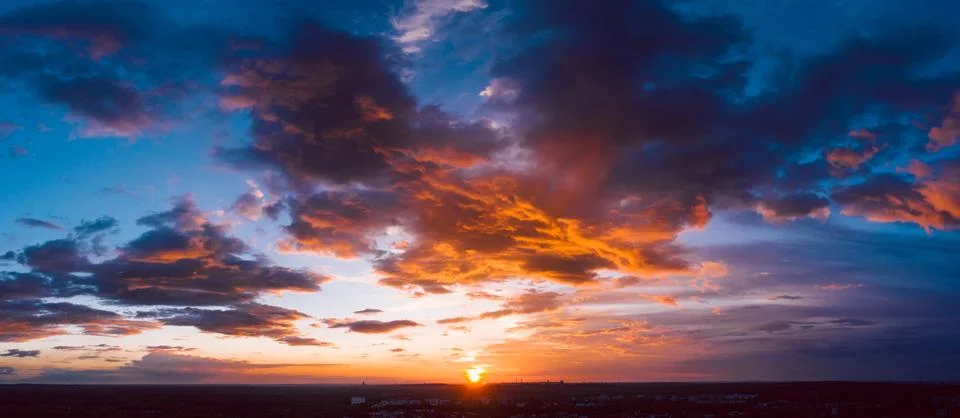 Dramatic orange sky at sunset Stock Photos