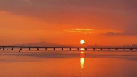 Dramatic Orange Sunrise over Sea at Gaoqi North Road, Xiamen China Stock Footage 337111110