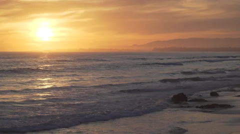 Dramatic orange sunset at the beautiful Mesa Beach Stock Footage 62433676