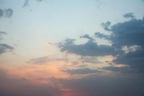 Dramatic orange sunset with clouds after rain Stock Photos