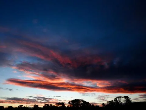 Dramatic Orange Sunset Clouds Stock Photos