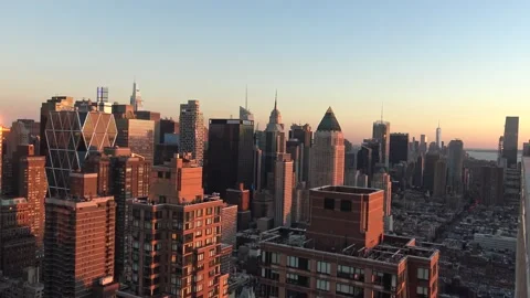Dramatic orange sunset on Manhattan, moving from Central Park down to the Fre Stock Footage 161272862