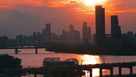 Dramatic Orange Sunset Over Seoul Skyline and Banpo Bridge and Dongjak Bridge Stock Footage 316747390