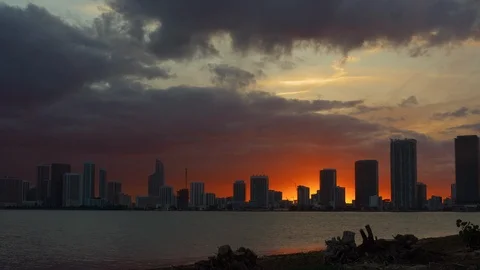 Dramatic Orange sunset settles over the coastline of Miami Beach, Florida Stock Footage 100653092