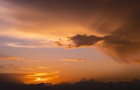 Dramatic orange sunset sky. Beautiful textural background of the sunset Stock Photos
