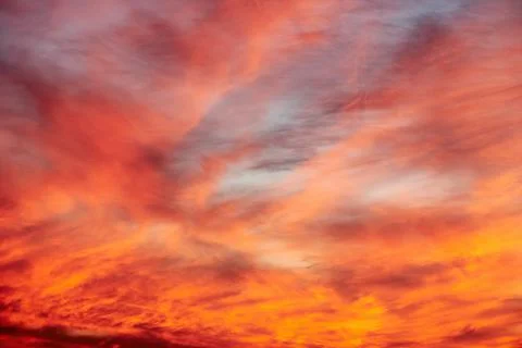 Dramatic orange sunset sky with clouds Stock Photos