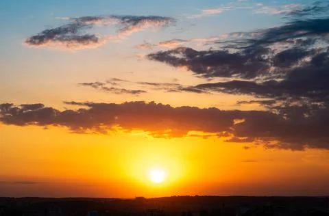 Dramatic orange sunset sky. Natural background Stock Photos