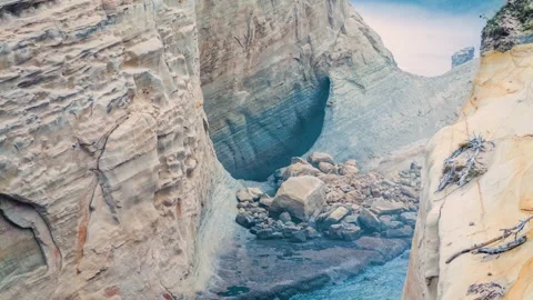 Dramatic Oregon Coast Seascape with Rugged Sandstone Arch and Crashing Waves Stock Footage 326708899