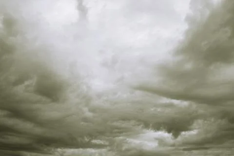 Dramatic overcast cloudy sky. Clouds flying over horizon, cloudscape. Stock Photos