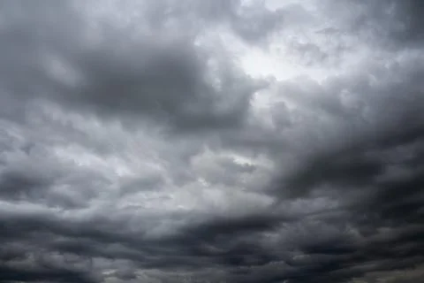 Dramatic overcast cloudy sky. Thunderclouds flying over horizon, cloudscape. Stock Photos