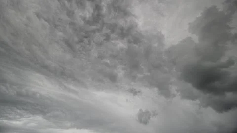 A Dramatic Overcast Sky Captivates with Stunning Fluid Cloud Patterns and Shapes Stock Photos