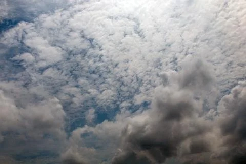 Dramatic overcast sky featuring layered cumulus and altocumulus fluffy clou.. Stock Photos