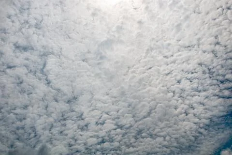 Dramatic overcast sky featuring layered cumulus and altocumulus fluffy clou.. Stock Photos