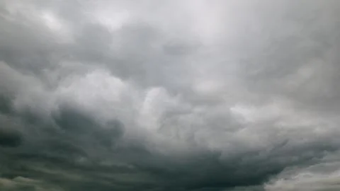 A Dramatic Overcast Sky Filled with Dark Clouds Making a Striking Visual Stateme Stockfoto's