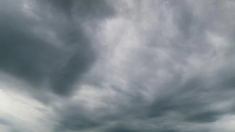 The Dramatic Overcast Sky Filled with Layered Clouds Creates a Stunning Visual E 스톡 사진