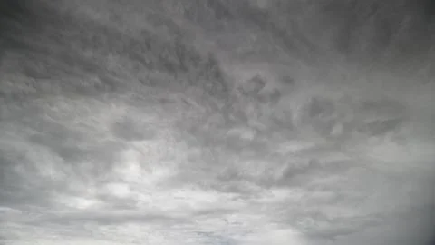 A Dramatic Overcast Sky Filled with Layers of Beautiful and Varied Clouds Above Fotos Stock