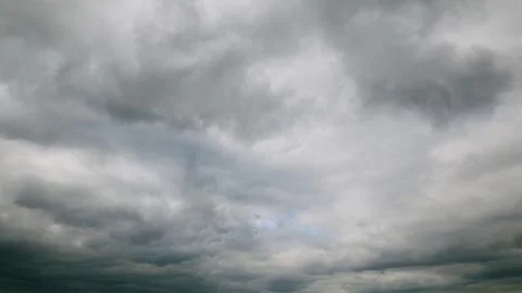 Dramatic Overcast Sky Filled with Rolling Clouds, Conveying a Unique Atmosphere Stock Photos