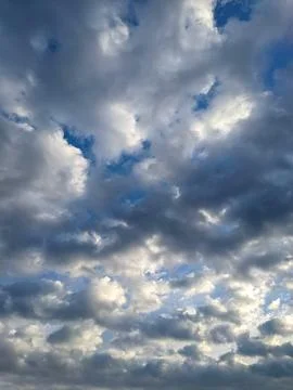 Dramatic Overcast Sky with Layered Clouds &amp;amp; Patches of Blue Light Stock Photos