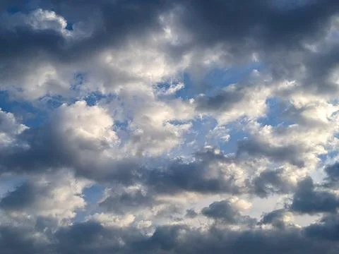 Dramatic Overcast Sky with Layered Clouds &amp;amp; Patches of Blue Light Stock Photos