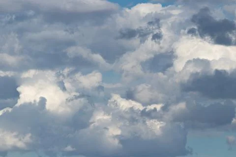 Dramatic Overcast Sky With Layered Cumulus Clouds, Sunlit Patches And Blue .. Stock Photos