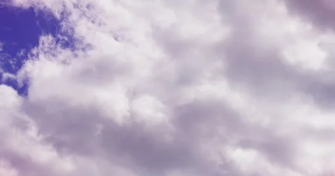 Dramatic overcast sky with layered gray clouds and a small patch of blue 스톡 동영상 336393257