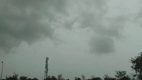 Dramatic Overcast Sky Storm Clouds Above Suburban Landscape With Tower Stock Footage 333493489
