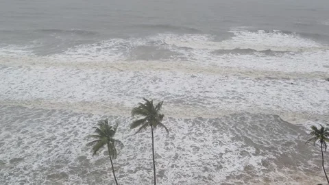 Dramatic overhead view of a tropical beach during high tide or a storm. Stock Footage 319573886