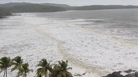 Dramatic overhead view of a tropical beach during high tide or a storm,  Stock Footage 319573894