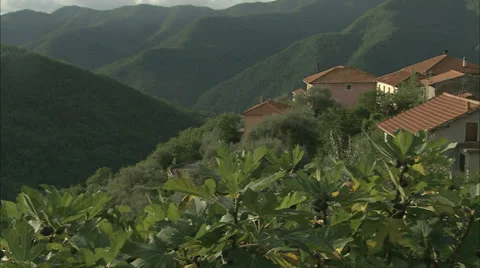 Dramatic Pan of Epic Hills and a small village in the Italian Riviera Stock Footage 35804588