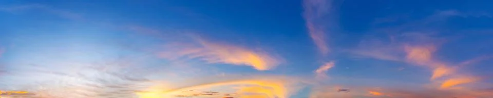 Dramatic panorama sky with cloud on sunrise and sunset time. Stock Photos